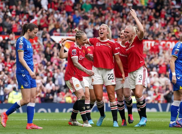 Manchester United's Alessia Russo (centre) celebrates with team-mates after scoring their side's third goal agaisnt Everton at Old Trafford Picture: Martin Rickett/PA