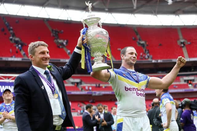 Tony Smith holds the Challenge Cup trophy aloft with Adrian Morley. (Picture: SWPix.com)