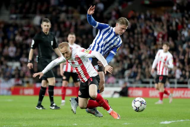 Sunderland's Alex Pritchard and Sheffield Wednesday's George Byers battle for the ball. Picture: PA
