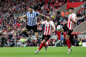 BATTLE: Lee Gregory fights for the ball in Sheffield Wednesday's 1-0 play-off semi-final first-leg defeat at Sunderland
