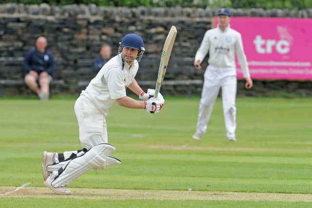 Woodlands opener Tim Walton hits four runs in his innings of 57 in the 43-run win over Bradford Premier rivals Farsley. Picture: Steve Riding.