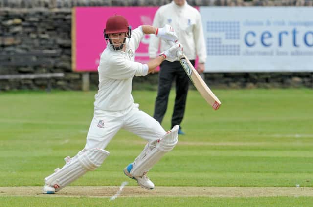 Woodlands captain Brad Schmulian goes on the attack against Farsley during his innings of 55. Picture: Steve Riding.
