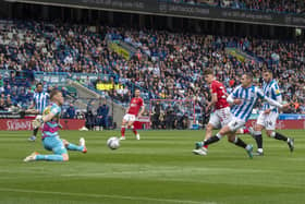 Huddersfield Town's Harry Toffolo slips the ball past Bristol City goalkeeper Daniel Bentley to score the hosts' first goal  Picture: Tony Johnson