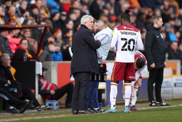 The centre forward, pictured in discussion with Mark Hughes, scored two goals in 23 games for Bradford this season.