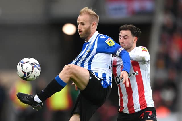 Wednesday's Barry Bannan is challenged by Sunderland's Patrick Roberts at the Stadium of Light. (Photo by Stu Forster/Getty Images)