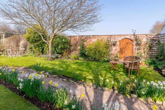 The property comes with a 100ft lawn, an orchard, an area of timber decking and a small private lawned area to the side. The walled front garden has attractive border flowerbeds, areas of lawn and a paved pathway.