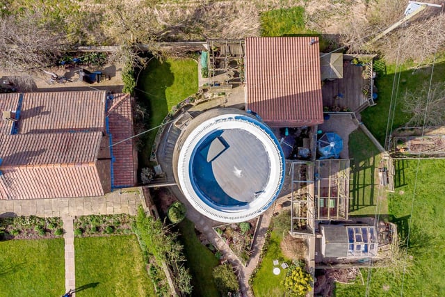 A drone shot looking down on the windmill and the grounds