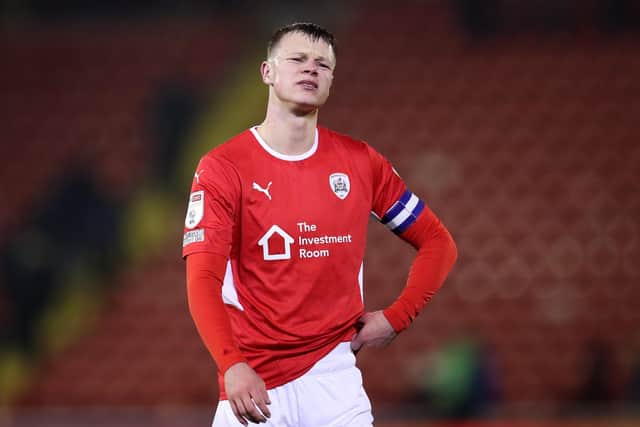 Will the likes of Mads Andersen, above, and goalkeeper Brad Collins, inset, have played their final games for Barnsley as the club face up to the reality of relegation to League One. (Picture: George Wood/Getty Images)