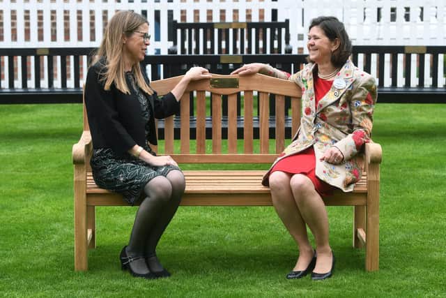 His sister Lizzie (left) helped unveil the bench opposite the press room with the racecourse chairman, Bridget Guerin (right), in a short ceremony yesterday.
