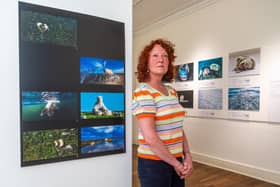 Curator Janice Smith with some of the 100 or some of the images from The Wildlife Photographer of the Year exhibition on display at Sewerby Hall and Gardens in East Yorkshire. Picture James Hardisty.