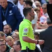 SECOND VIEW: Referee Chris Kavanagh uses video technology during Leeds United's Premier League game at Arsenal