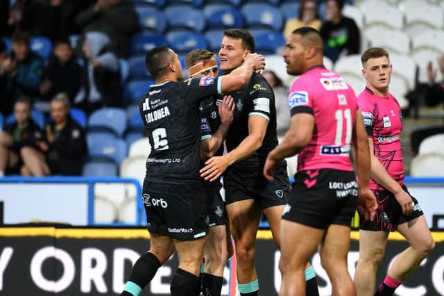 Huddersfield celebrate Louis Senior's first try. (Picture: Jonathan Gawthorpe)
