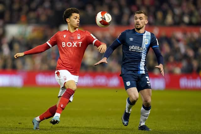 Nottingham Forest's Brennan Johnson battles with Huddersfield Town's Harry Toffolo earlier in the season (Picture: PA)