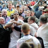 Jermaine Beckford is mobbed by Leeds United fans after the Bristol Rovers game back in 2010. Picture: Jonathan Gawthorpe