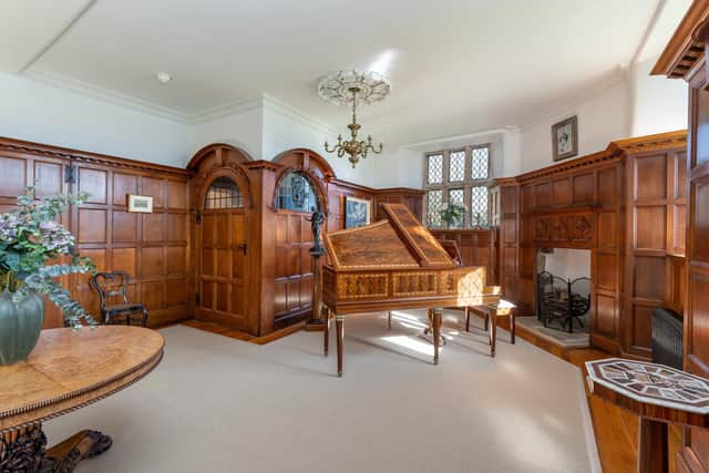 One of the reception rooms with oak panelling