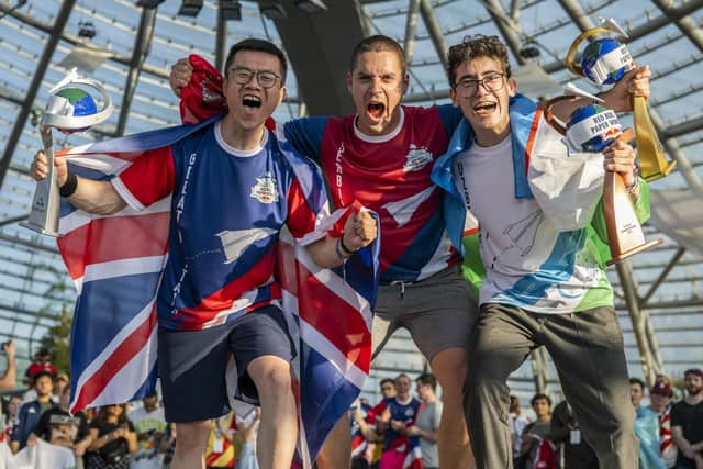 Yicheng Sun, Lazar Krstic and Aibek Atabay celebrating during the Award Ceremony for the Longest Distance discipline during the Red Bull Paper Wings World Finals 2022 in Salzburg