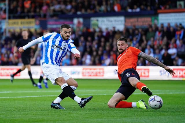 OPENER: Danel Sinani’s low strike opened the scoring while Sonny Bradley,right, levelled on the half hour for Luton. Picture: PA Wire.