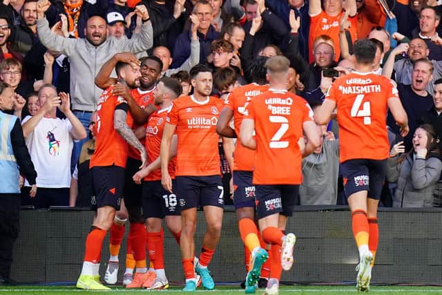 ALL SQUARE: Luton celebrate their equaliser against Huddersfield. Picture: PA Wire.