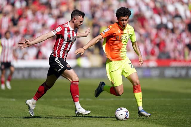 Sheffield United's Jack Robinson (left) and Nottingham Forest's Brennan Johnson battle for the ball at Bramall Lane Picture: Tim Goode/PA