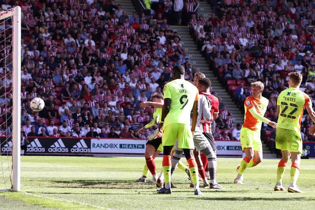 LATE STRIKE: Sheffield United's Sander Berge (hidden) scores a late goal at Bramall Lane Picture: Darren Staples / Sportimage