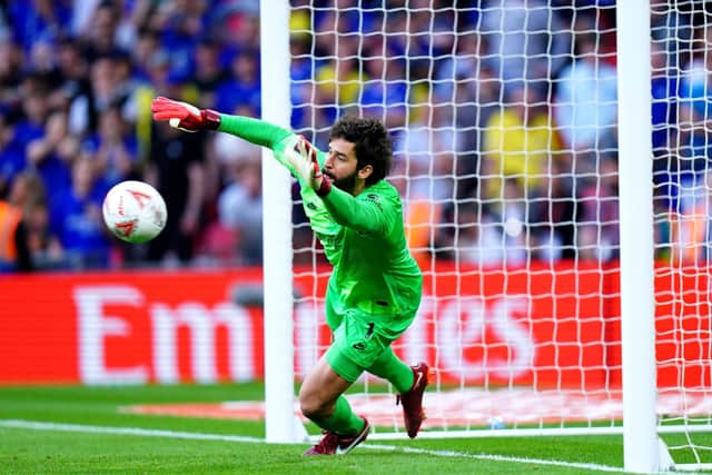 Liverpool goalkeeper Alisson saves Mason Mount's penalty during the Emirates FA Cup final (Picture: PA)