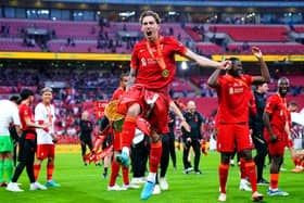 Liverpool's Kostas Tsimikas celebrates after winning the Emirates FA Cup final at Wembley Stadium (Picture: Adam Davy/PA)