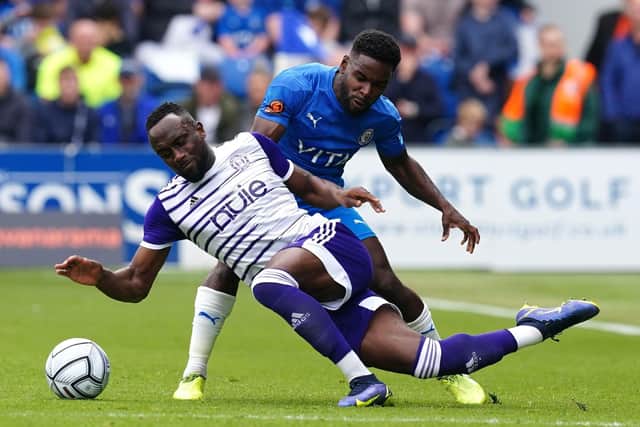 Stockport County's Zaine Francis-Angol (right) and Halifax Town's Jordan Slew battle for the ball  (Picture: Martin Rickett/PA)