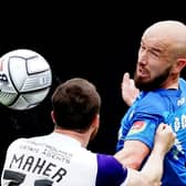 Halifax Town's Niall Maher (left) and Stockport County's Paddy Madden battle for the ball (Picture: Martin Rickett/PA)
