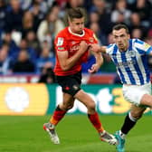Huddersfield Town's Harry Toffolo drives forward for the hosts against Luton. Picture: PA