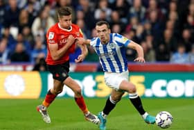 Huddersfield Town's Harry Toffolo drives forward for the hosts against Luton. Picture: PA