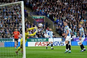 Huddersfield Town's rock-solid keeper Lee Nicholls shows his reflexes against Luton Town. Picture: PA