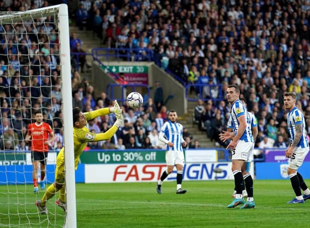 Huddersfield Town's rock-solid keeper Lee Nicholls shows his reflexes against Luton Town. Picture: PA