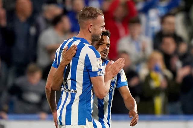 Huddersfield Town's Jordan Rhodes (left) celebrates with Duane Holmes after scoring. Picture: PA.