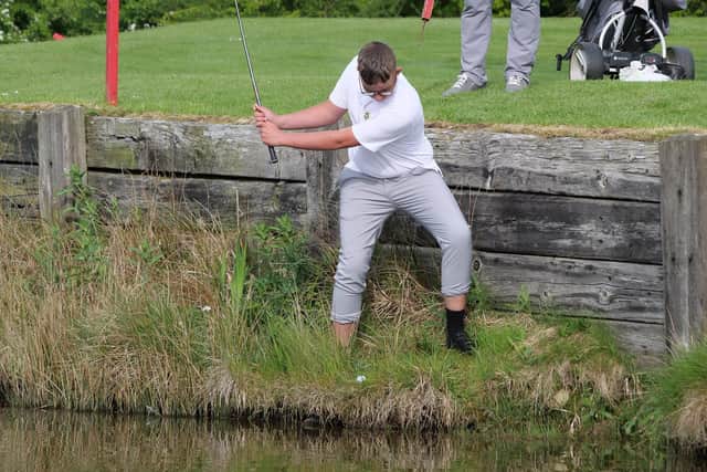 Crosland Heath's George Hanson making an improbable, adventurous and superbly thought out bogey at the par-3 11th in his singles for Halifax-Huddersfield at Romanby to win the hole after his opponent Simon Bradley (Otley) had found the water and made five. (Picture: Chris Stratford)