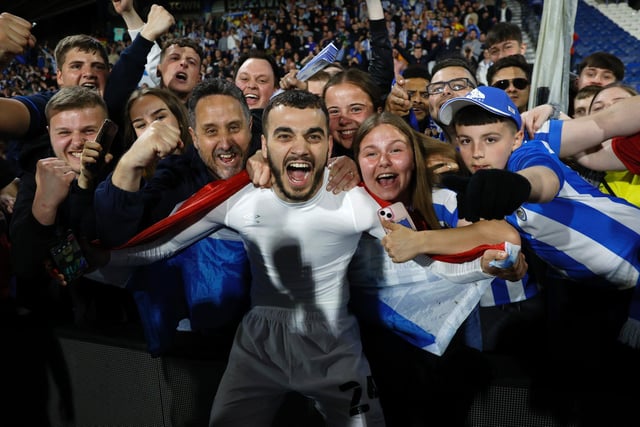 Danel Sinani enjoys the victory with the home fans.