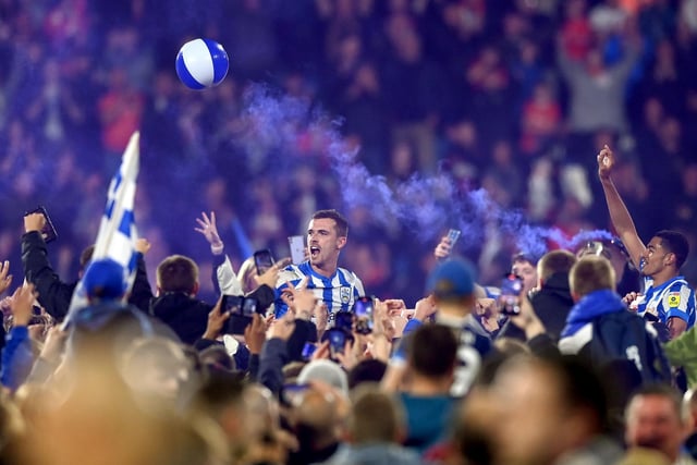 Harry Toffolo in the middle of Huddersfield Town fans.
