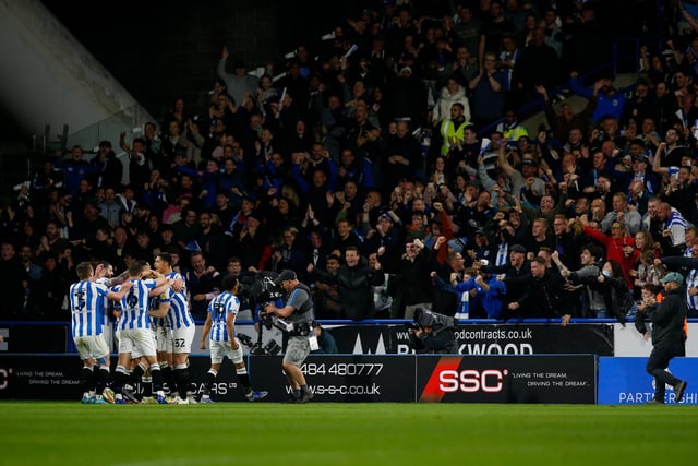 Huddersfield players celebrate following Jordan Rhodes's goal.