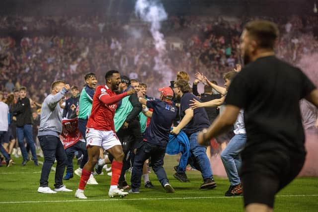 Nottingham Forest fans celebrate their play-off semi-final win against Sheffield United at the City Ground on Tuesday night - but one fan went too far by attacking Billy Sharp. Picture: Bruce Rollinson