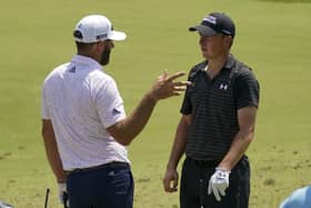 Looking relaxed: Jordan Spieth shares a joke with Dustin Johnson during a practice round for the US PGA Championship. (Picture: AP)