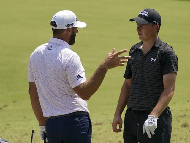 Looking relaxed: Jordan Spieth shares a joke with Dustin Johnson during a practice round for the US PGA Championship. (Picture: AP)
