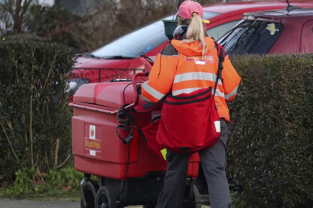 Royal Mail has said it will need to hike prices and slash costs to offset soaring inflation amid an “uncertain” outlook for the economy as it posted a rise in annual earnings.