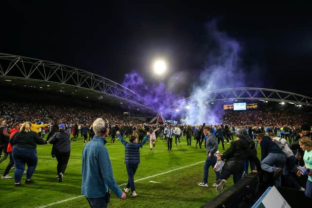 PITCH INVASION: At Huddersfield Town on Monday. Picture: Getty Images.