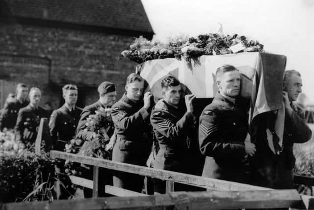 The coffin of Flt Sgt Leslie Pidd, who was shot down and killed in his hurricane during the Battle of Britain over Kent, being carried from his home at 6 Cottage Holdings, Dunswell, near Hull in 1940.