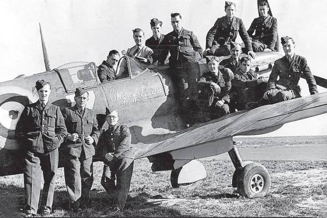 Circa 1941: A Spitfire funded by the Leeds Spitfire fund with members of the 609 West Riding Squadron. When the fund was launched in 1940 nearly £30,000 was raised. The 609 was originally composed of volunteers and were based at Leeds Bradford Airport. They flew Spitfires and won distinction during the Battle of Britain, being the 1st Spitfire Squadron to shoot down 100 enemy aircraft.