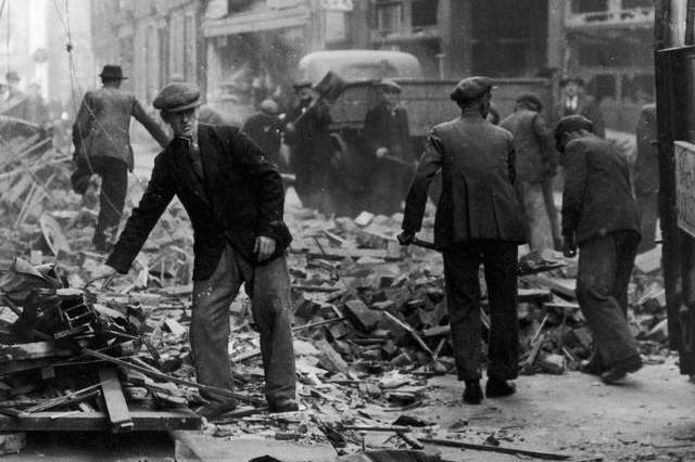 Men clean up the ruins left by a bombing in York.
