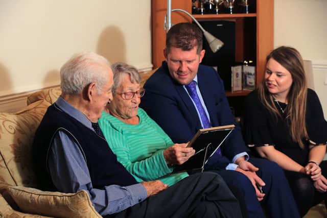 James Mitchson and reporter Lucy Leeson with Pat and John Thompson. The Yorkshire Post fundraised for the great-grandfather after he was conned out of his life-savings by fraudsters. The Just Giving page has raised over £15,000 so far. John is pictured with is wife Pat, Yorkshire Post Editor James Mitchinson, and Crime Correspondent Lucy Leeson. Picture: Chris Etchells