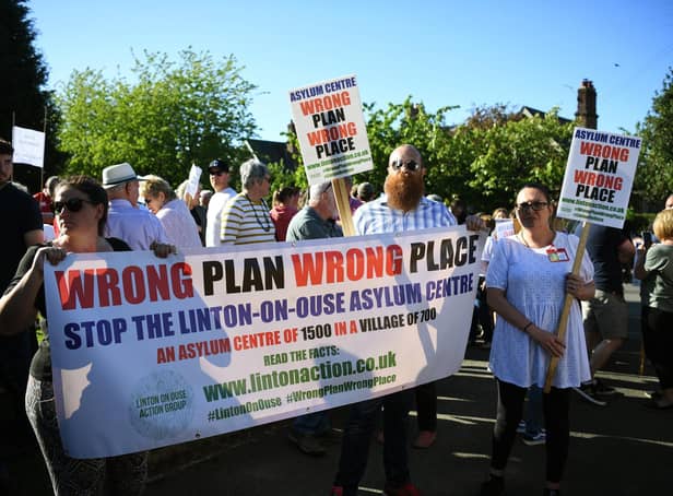 More than 100 protestors chanted “Wrong Plan, Wrong Place,” ahead of  a parish council meeting in the village attended by several civil servants and managers from security firm Serco, in a bid to allay a raft of concerns about launching the centre at the former RAF Linton on Ouse base on May 31.