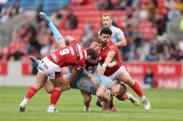 Second best: Leeds forward Sam Walters is tackled during the defeat by Salford - coach Rohan Smith's first match in charge. Picture: John Clifton/SWPix.com