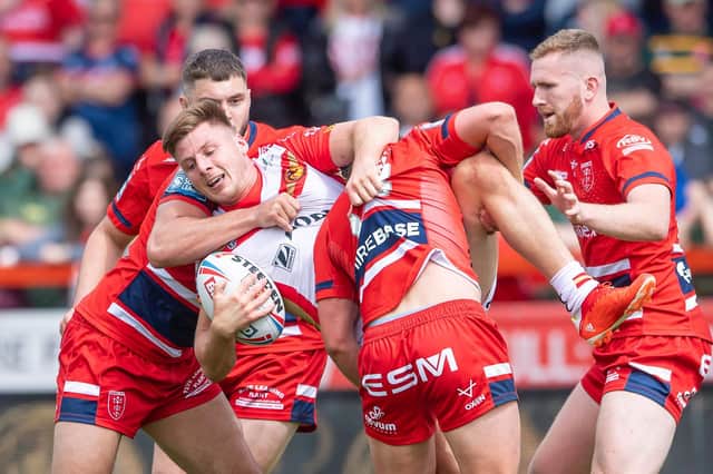 Hull KR get to grips with Tom Davies. (Picture: SWPix.com)
