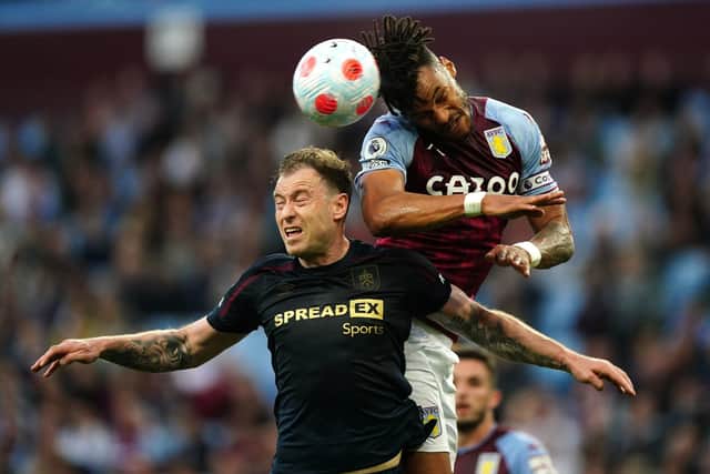 One last push: Burnley’s Ashley Barnes, left, and Aston Villa’s Tyrone Mings battle for the ball. (Picture: PA)